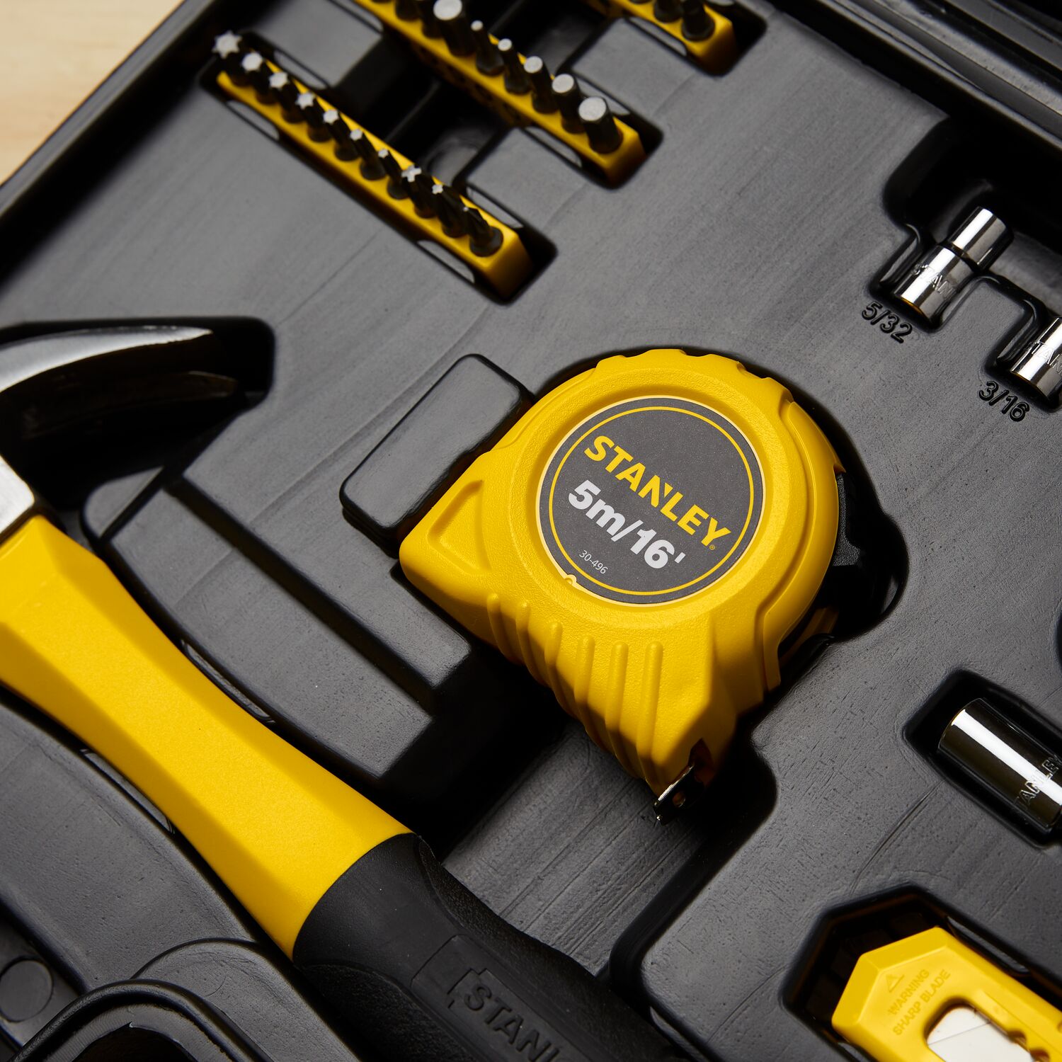 STANLEY 94-248 tool set photography showing yellow tape measure, hammer, and assorted bits in molded black case.