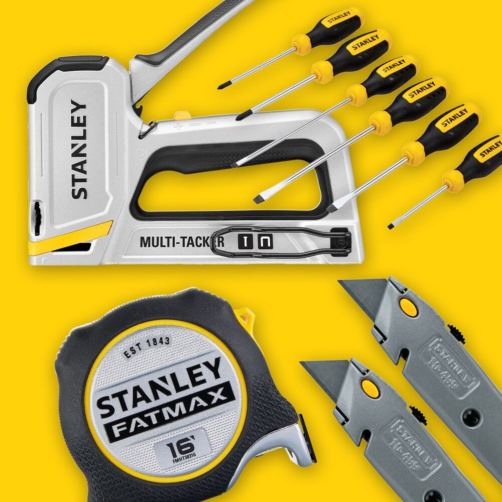 STANLEY STHT60025 hand tool set with stapler, tape measure, screwdrivers, and utility knives on yellow background.
